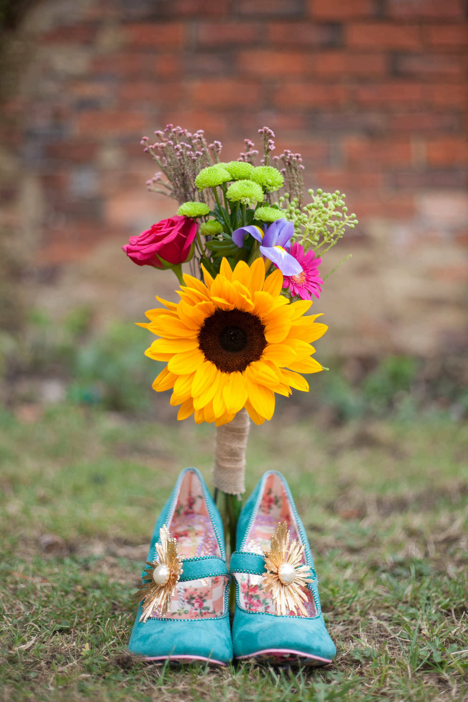Colourful Barn Wedding Photography - bridal shoes and bouquet details taken at Gina & Simon's house in Milton Keynes