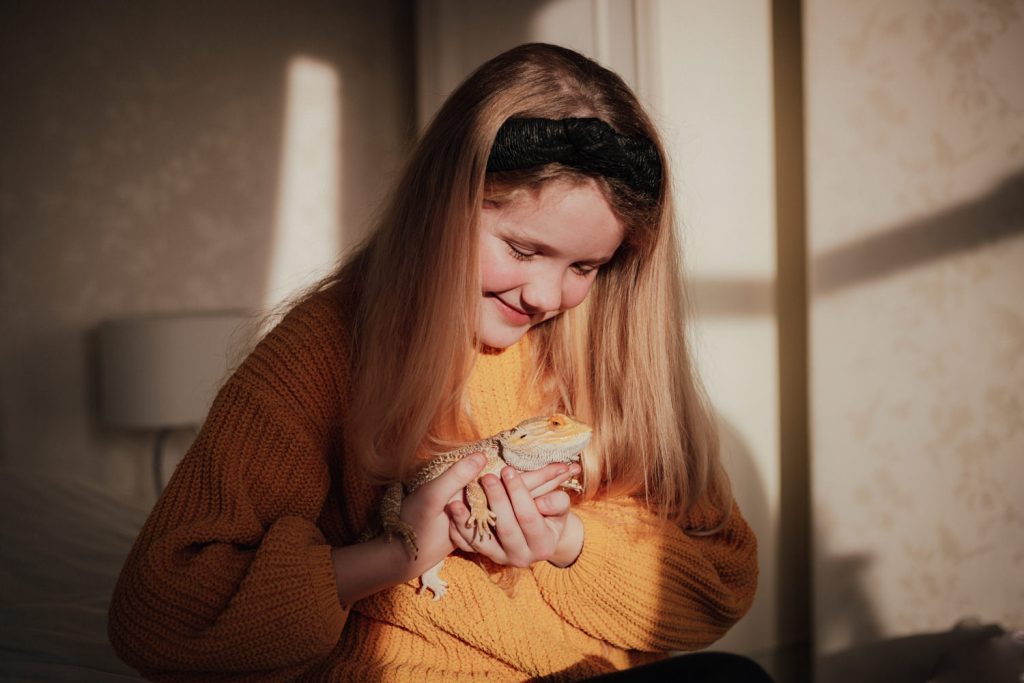 Family photography in Devon, child with pet Lizard, winter light
