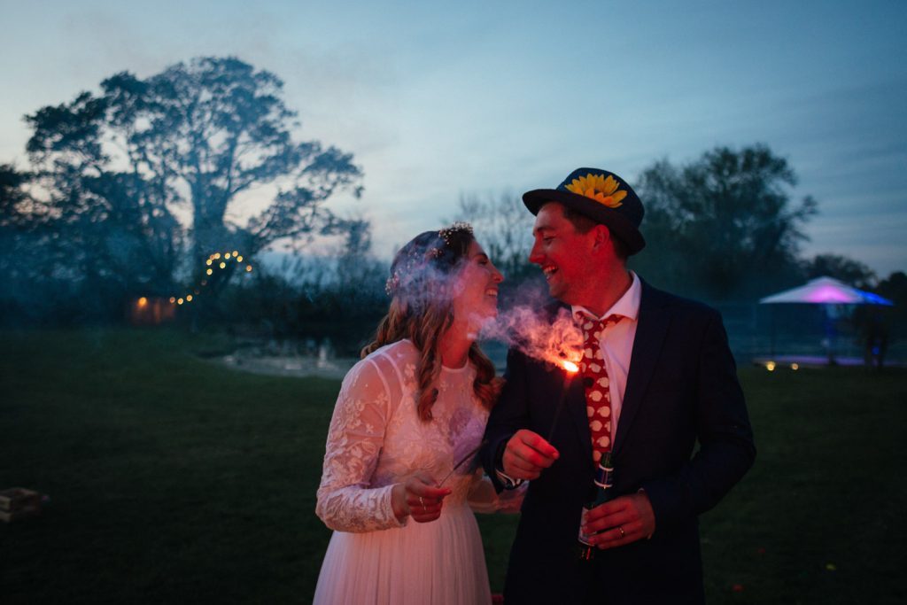 Waterside Country Barn Wedding Photographer, sparklers, wedding guests, festival style wedding